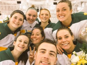 Assistant Women's Ice Hockey Coach Greg Haney takes a selfie with the 7 seniors.