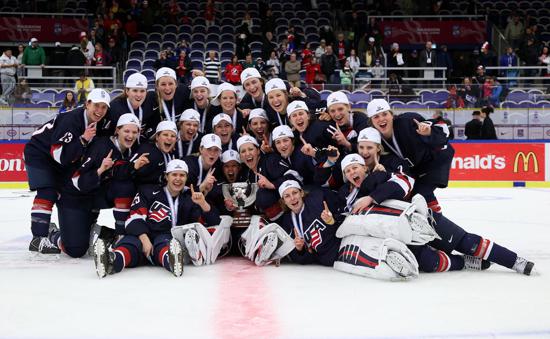 MALMO, SWEDEN - APRIL 4: USA players celebrate after a 7-5 gold medal game win over Canada at the 2015 IIHF Ice Hockey Women's World Championship. (Photo by Andre Ringuette/HHOF-IIHF Images)