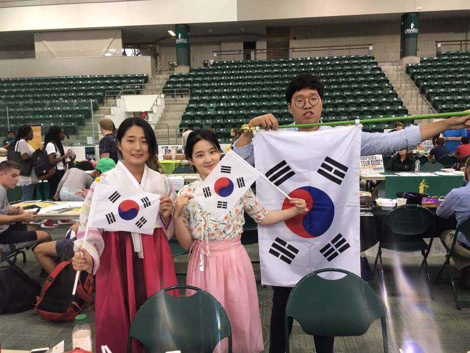 Korean Student Association members hold up flags