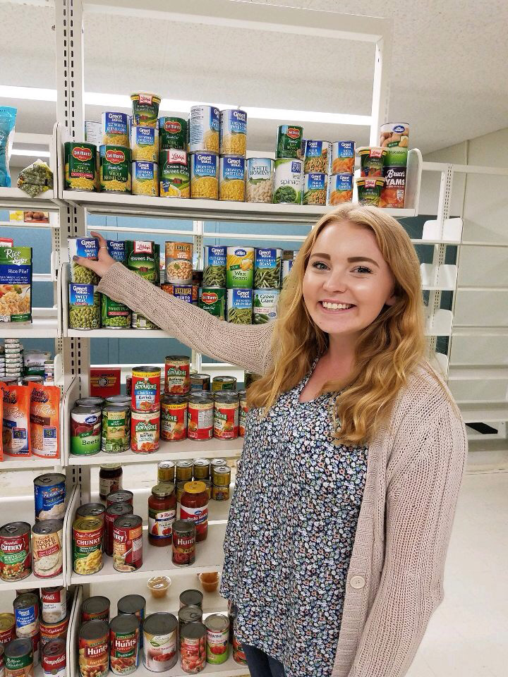 Kayla Murphy, the SHOP (Students Helping Oz Peers) coordinator working in the campus food pantry